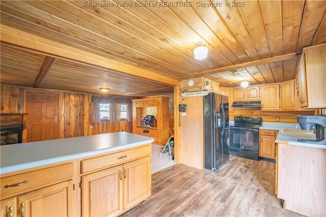 356 Joes Rd, Bomont, WV 25164 - kitchen with black appliances, wood ceiling, light countertops, wood walls, and under cabinet range hood