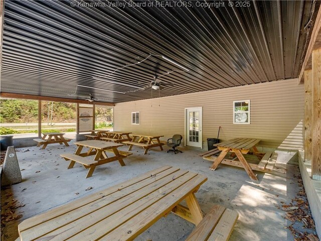 view of patio with a ceiling fan and outdoor dining area