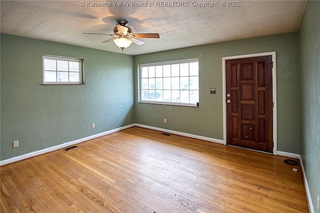 455 Kane St, Milton, WV 25541 - spare room featuring wood finished floors, visible vents, ceiling fan, and a healthy amount of sunlight