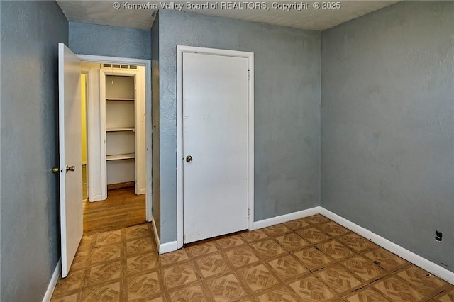 455 Kane St, Milton, WV 25541 - unfurnished bedroom with parquet flooring and baseboards