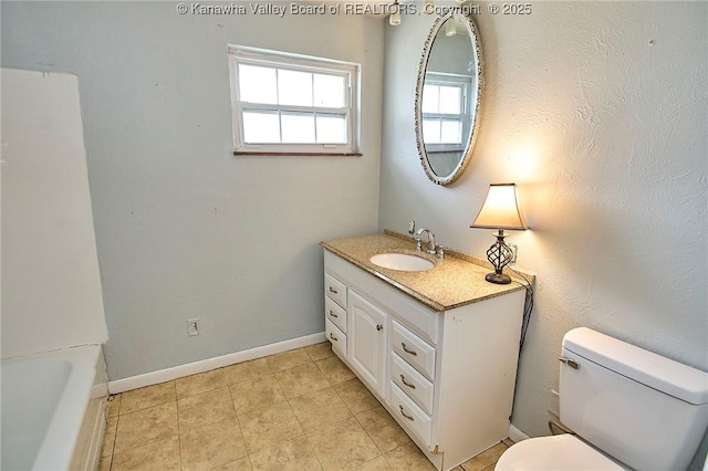 455 Kane St, Milton, WV 25541 - full bathroom featuring baseboards, vanity, tile patterned floors, and toilet