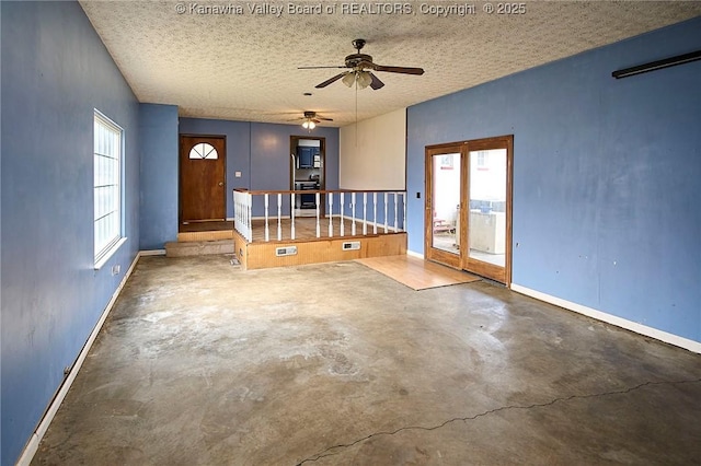 455 Kane St, Milton, WV 25541 - interior space featuring a ceiling fan, baseboards, concrete floors, and a textured ceiling