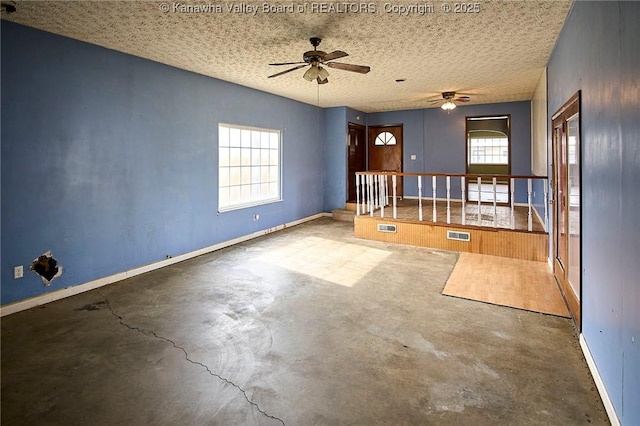 455 Kane St, Milton, WV 25541 - empty room with ceiling fan, concrete flooring, a textured ceiling, and visible vents