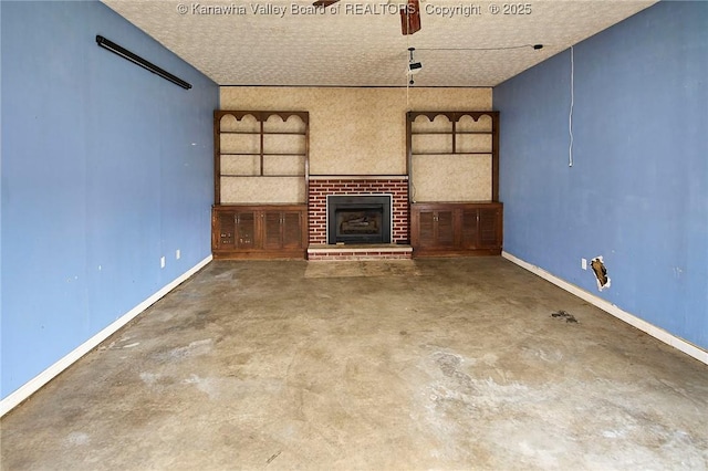 455 Kane St, Milton, WV 25541 - unfurnished living room featuring a fireplace, concrete floors, and baseboards