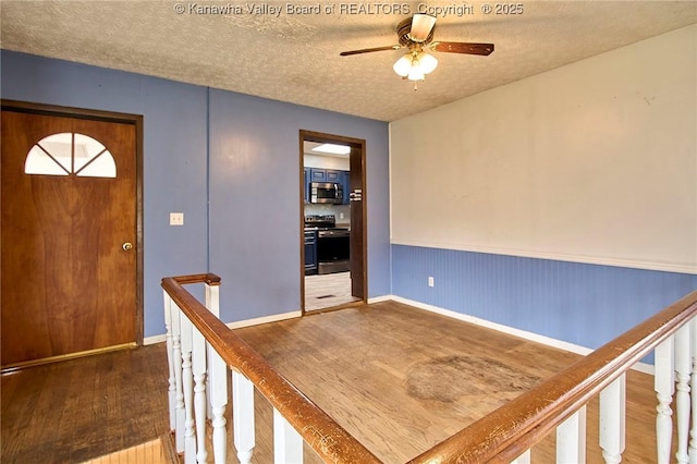 455 Kane St, Milton, WV 25541 - entryway featuring ceiling fan, wood finished floors, and a textured ceiling