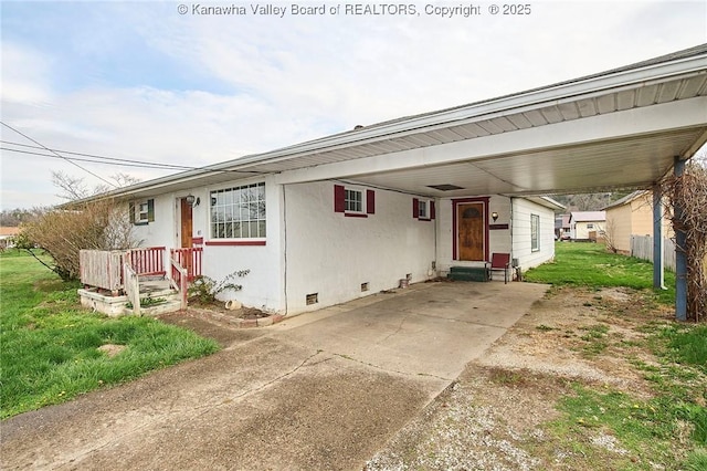 455 Kane St, Milton, WV 25541 - view of front of home featuring crawl space, driveway, an attached carport, and a front yard
