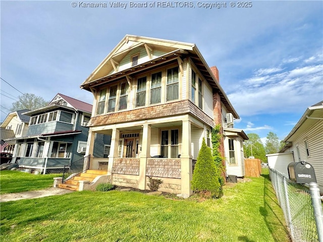 2206 Jefferson Ave, Point Pleasant, WV 25550 - view of front of home with a porch, a front lawn, a chimney, and fence