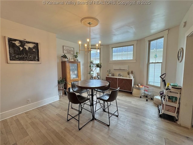 2206 Jefferson Ave, Point Pleasant, WV 25550 - dining area with light wood-style flooring, baseboards, and a notable chandelier