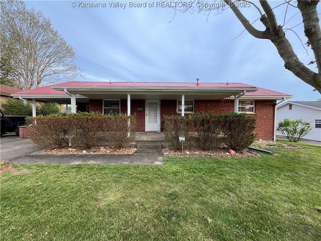 ranch-style house featuring a porch, a front lawn, and brick siding