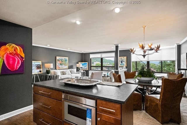 1578 Kanawha Blvd Unit 7C, Charleston, WV 25311 - kitchen with dark countertops, a chandelier, ornamental molding, wood finished floors, and recessed lighting