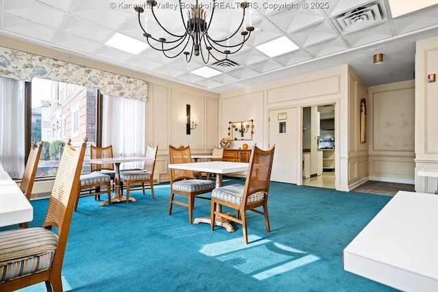 1578 Kanawha Blvd Unit 7C, Charleston, WV 25311 - dining area featuring a decorative wall, a chandelier, and carpet