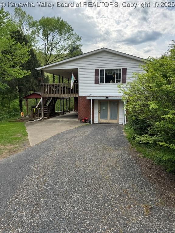 12376 Elk River Rd N, Clendenin, WV 25045 - view of front facade with asphalt driveway and stairs