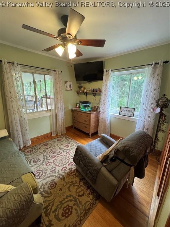 12376 Elk River Rd N, Clendenin, WV 25045 - living area with wood finished floors, ornamental molding, a ceiling fan, and baseboards