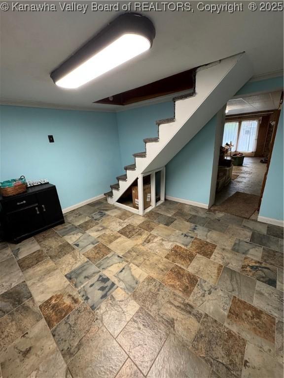 12376 Elk River Rd N, Clendenin, WV 25045 - below grade area with stone tile flooring, stairs, and baseboards