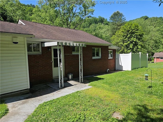 12376 Elk River Rd N, Clendenin, WV 25045 - back of house with brick siding and a shingled roof