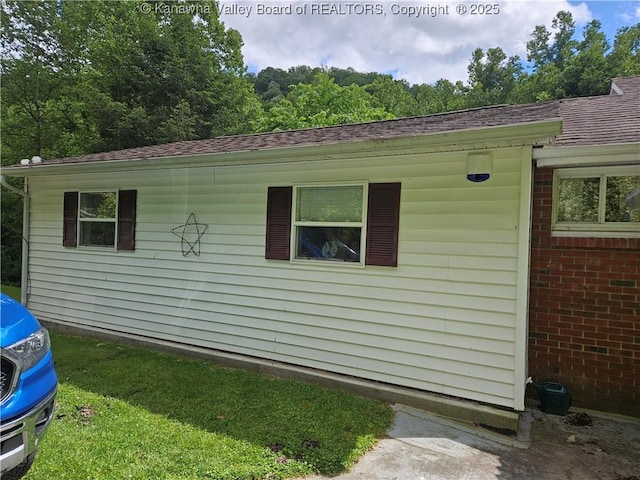 12376 Elk River Rd N, Clendenin, WV 25045 - view of side of home with a shingled roof and brick siding