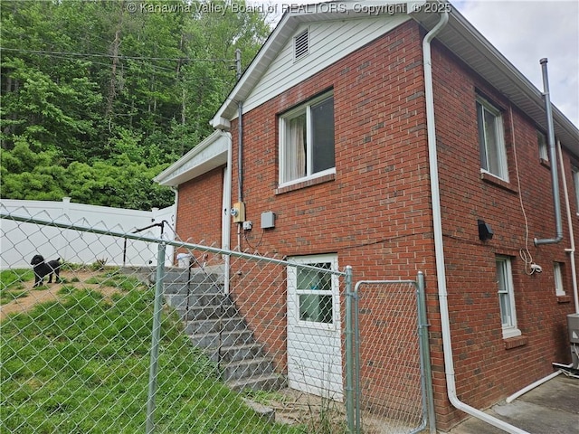 12376 Elk River Rd N, Clendenin, WV 25045 - view of property exterior featuring brick siding and a gate