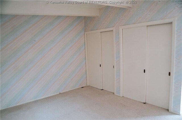 207 Mckinley Ave, Charleston, WV 25314 - unfurnished bedroom featuring carpet and two closets