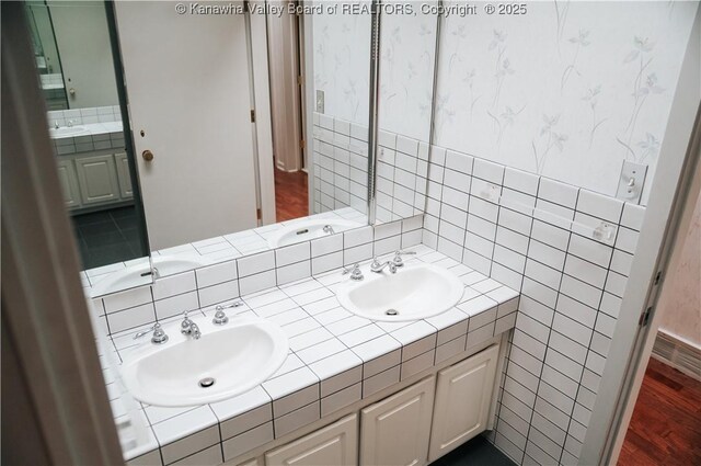207 Mckinley Ave, Charleston, WV 25314 - full bathroom featuring double vanity, tile walls, and a sink