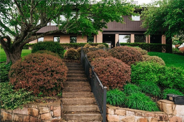 207 Mckinley Ave, Charleston, WV 25314 - view of front facade featuring stairway and brick siding