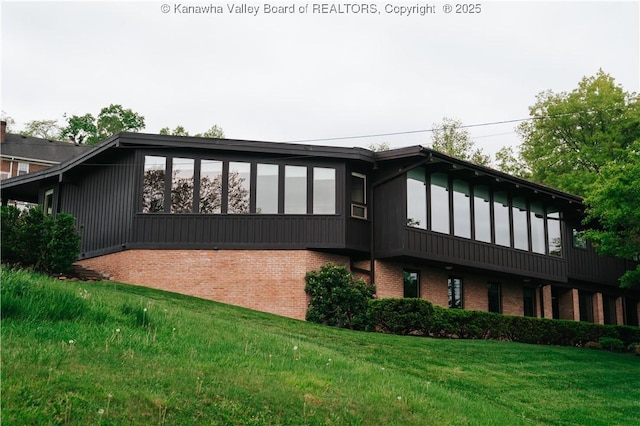 207 Mckinley Ave, Charleston, WV 25314 - back of house featuring a yard and brick siding