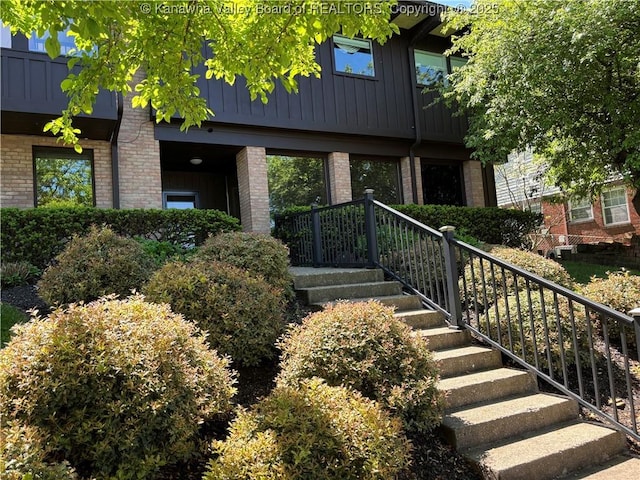 207 Mckinley Ave, Charleston, WV 25314 - property entrance featuring brick siding and board and batten siding