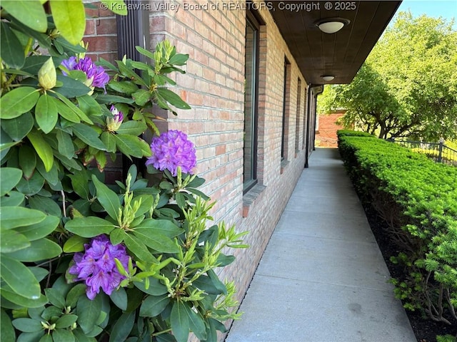 207 Mckinley Ave, Charleston, WV 25314 - view of side of home featuring brick siding and fence