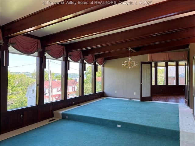207 Mckinley Ave, Charleston, WV 25314 - carpeted empty room featuring an inviting chandelier