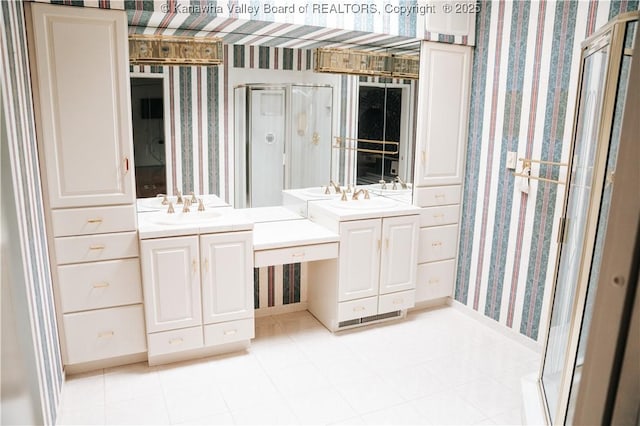 207 Mckinley Ave, Charleston, WV 25314 - full bathroom featuring two vanities, wallpapered walls, a shower stall, and a sink