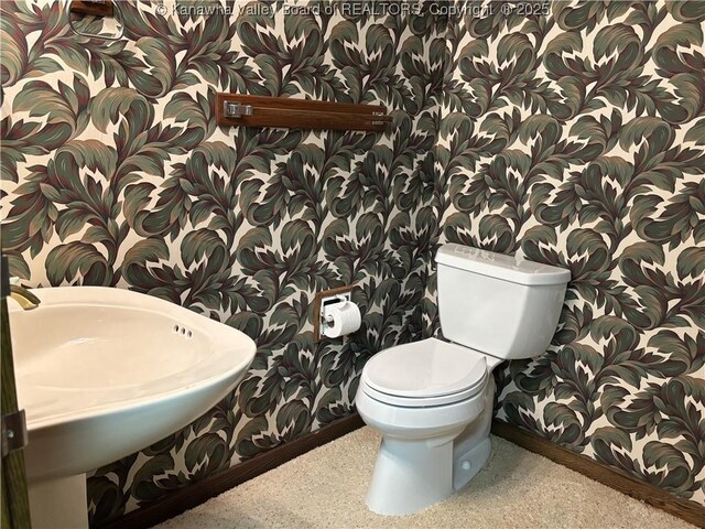 207 Mckinley Ave, Charleston, WV 25314 - half bath featuring a sink, baseboards, toilet, and wallpapered walls