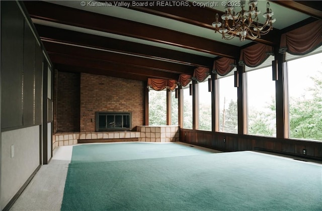 207 Mckinley Ave, Charleston, WV 25314 - unfurnished sunroom featuring an inviting chandelier, carpet flooring, and beam ceiling