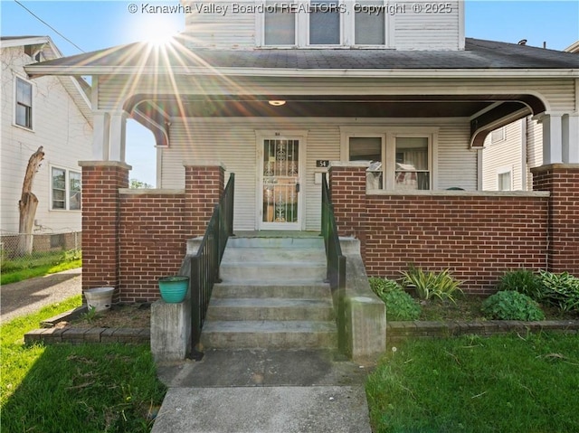 54 Hunt Ave, Charleston, WV 25302 - view of exterior entry with a porch and brick siding