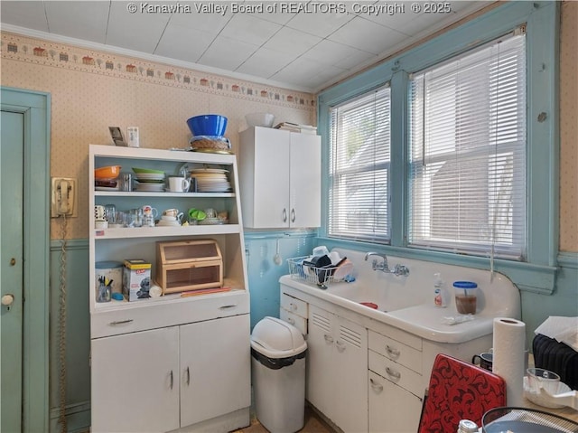 54 Hunt Ave, Charleston, WV 25302 - bathroom featuring wallpapered walls, a wainscoted wall, crown molding, and a sink