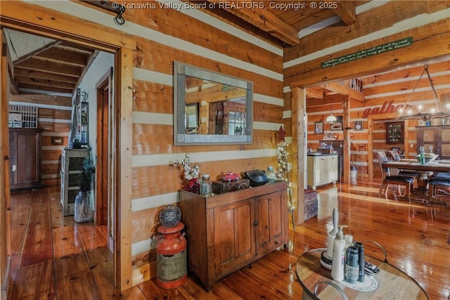 78 Cougar Mountain Dr, Winfield, WV 25213 - corridor with an inviting chandelier, wood ceiling, hardwood / wood-style flooring, beam ceiling, and wooden walls