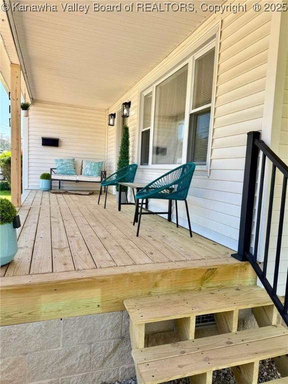 wooden terrace featuring a porch
