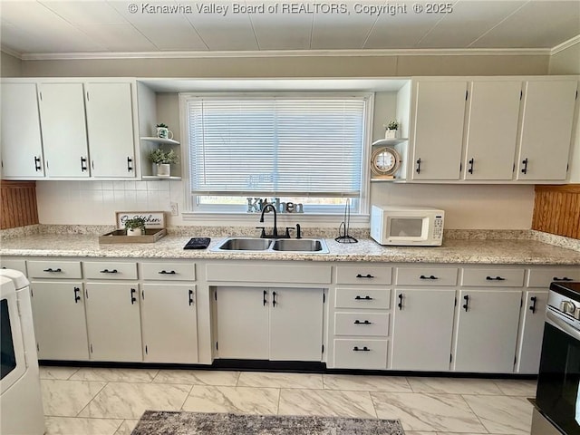 kitchen featuring a sink, marble finish floor, white microwave, and open shelves