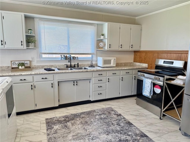 kitchen with stainless steel range with electric stovetop, a sink, open shelves, and white microwave