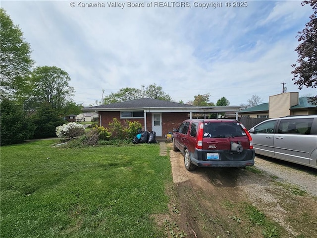 view of front of house with brick siding and a front lawn