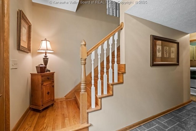 stairs featuring baseboards