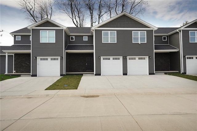 view of front of home featuring an attached garage and concrete driveway