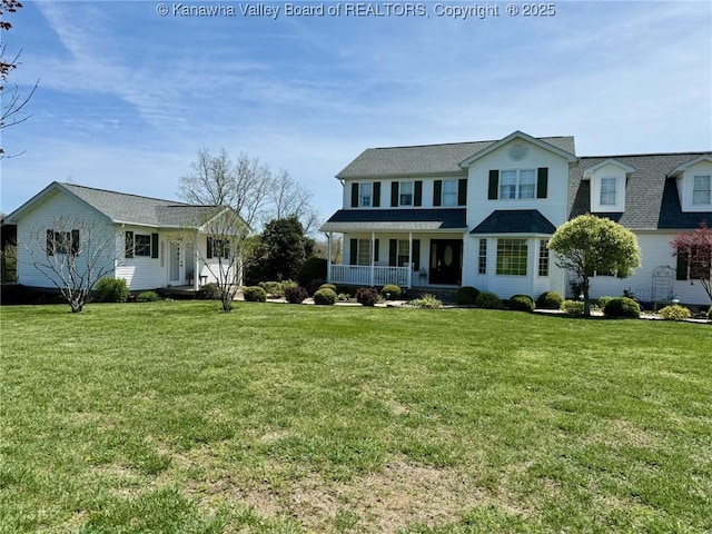 view of front of house with a porch and a front yard