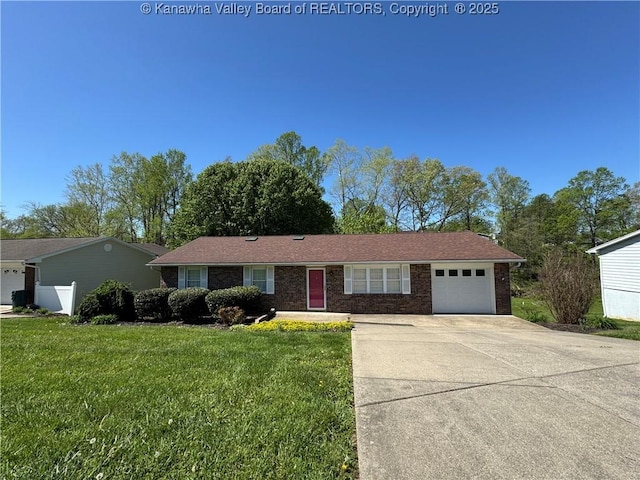 168 Jane Dr, Culloden, WV 25510 - ranch-style home featuring a garage, brick siding, a front yard, and driveway