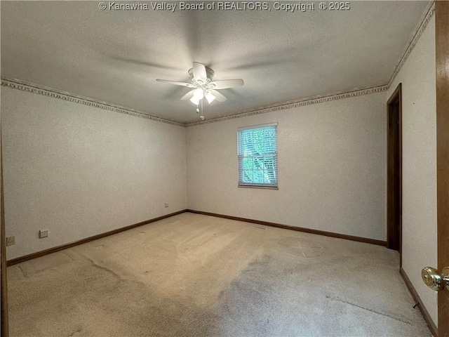 168 Jane Dr, Culloden, WV 25510 - spare room with a textured ceiling, ceiling fan, light carpet, and baseboards
