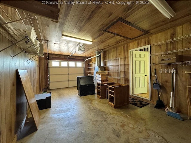 168 Jane Dr, Culloden, WV 25510 - garage featuring wood walls and a garage door opener