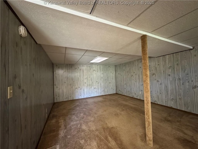 168 Jane Dr, Culloden, WV 25510 - finished below grade area featuring wooden walls, carpet flooring, and a drop ceiling