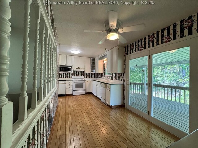 168 Jane Dr, Culloden, WV 25510 - kitchen featuring white electric range oven, a textured ceiling, stainless steel microwave, ceiling fan, and dishwasher