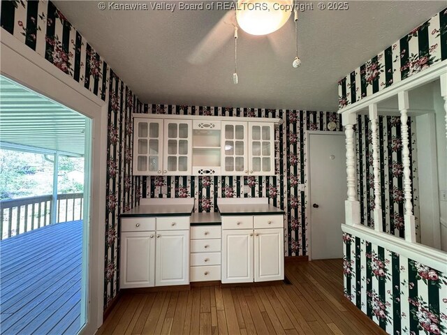 168 Jane Dr, Culloden, WV 25510 - wine area with wallpapered walls and hardwood / wood-style flooring