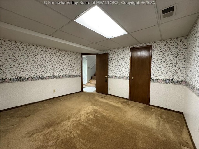 168 Jane Dr, Culloden, WV 25510 - carpeted spare room with visible vents, a paneled ceiling, wallpapered walls, and baseboards