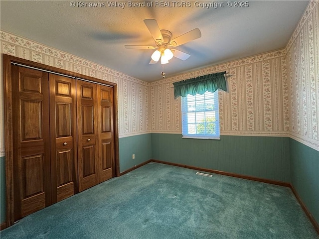168 Jane Dr, Culloden, WV 25510 - unfurnished bedroom with carpet flooring, visible vents, wainscoting, and a closet