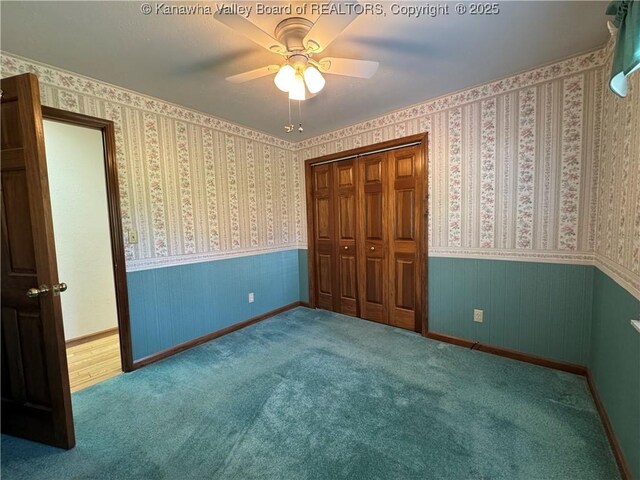 168 Jane Dr, Culloden, WV 25510 - unfurnished bedroom featuring a wainscoted wall, a ceiling fan, a closet, and baseboards
